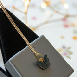 Gold-plated necklace featuring a black acrylic butterfly pendant