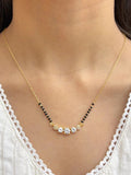 gold and black beaded mangalsutra for women