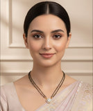 double-stranded mangalsutra with a round, diamond-studded pendant